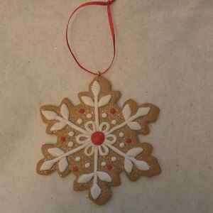 Festive Snowflake Ornament with Red and White Accents